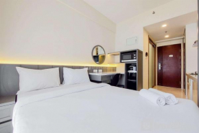 Studio Room with Simply Look at Sky House BSD near AEON By Travelio